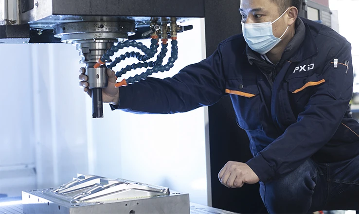 CNC machining in the PXID workshop