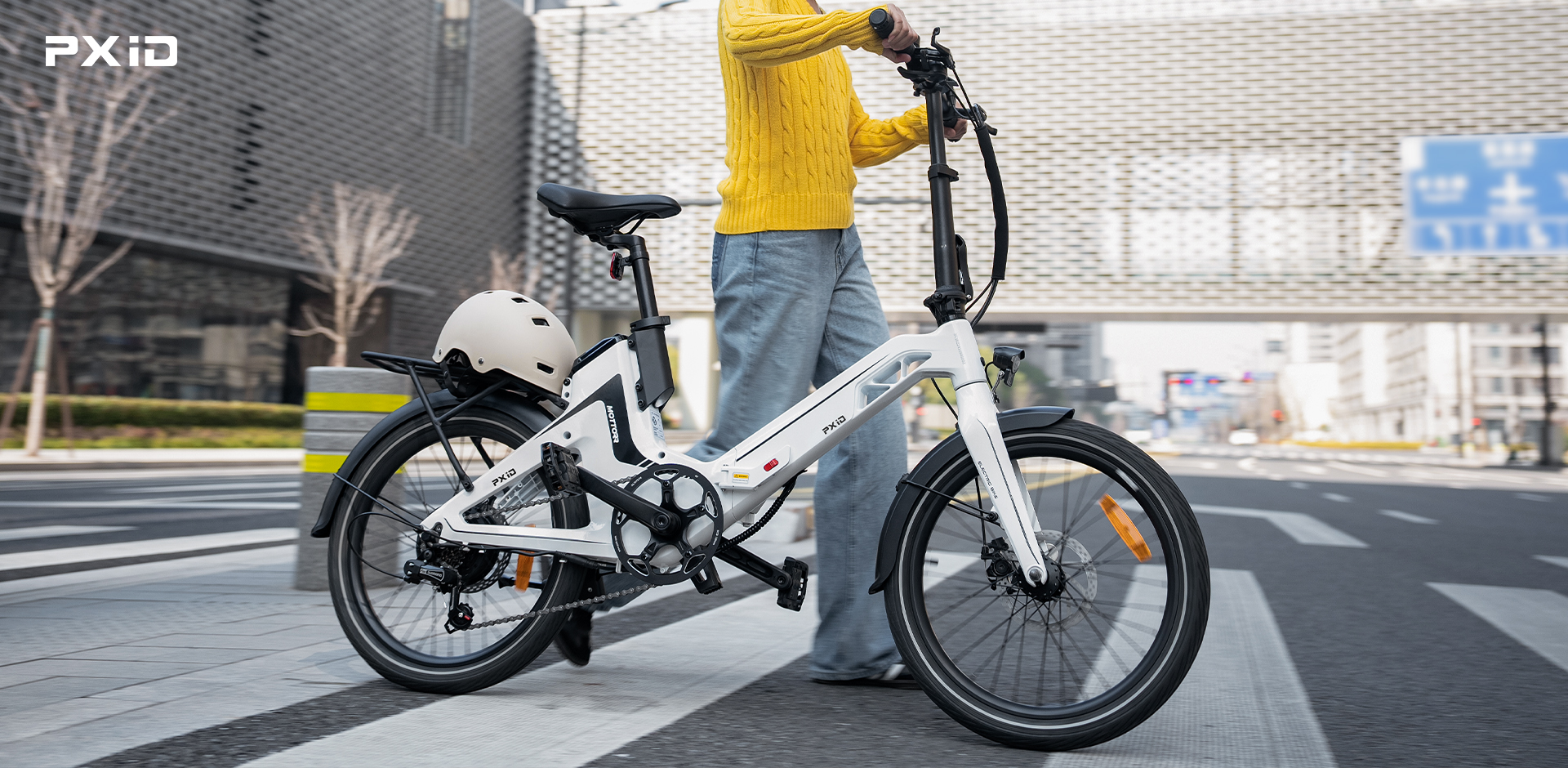 Female rider using a lightweight electric bicycle for city commuting with smart features and foldable design.